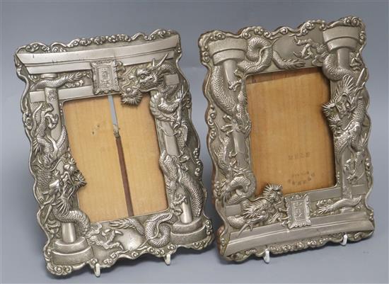 A pair of Japanese antimony dragon photograph easel frames height 24cm